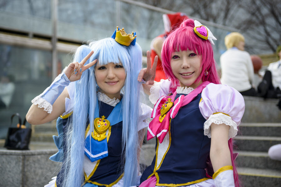 japanese girls dressed as anime characters pose at a cosplay gathering at Harajuku