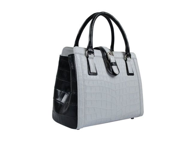 女性用の白と黒のクロコダイル革製ハンドバッグ